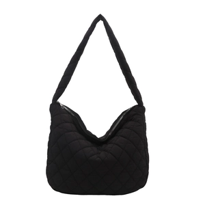 Minimalist black quilted puffer shoulder bag with diamond pattern and zipper closure