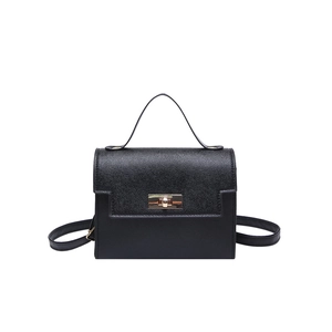 Structured black Saffiano leather handbag with top handle and gold rotating lock closure