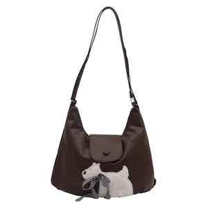 Brown faux leather tote bag featuring a plush terrier puppy and checkered bow accent