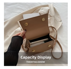 Top view of caramel leather crossbody bag showing internal capacity with magnetic closure
