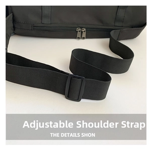 Detail of black crossbody bag with adjustable strap and dual silver zippers on nylon fabric