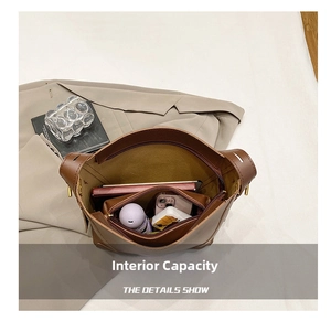 Interior view of brown leather tote bag showing large capacity for daily items