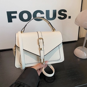 White lychee pattern flap crossbody bag with minimalist gold buckle and top handle