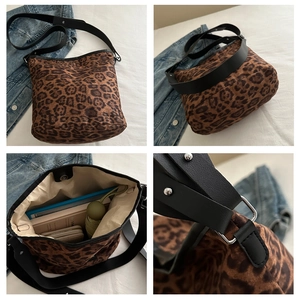 Detailed interior of leopard print bucket bag showing spacious storage for daily essentials