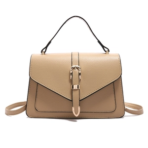 Beige lychee pattern leather crossbody bag with flap and golden buckle on white background