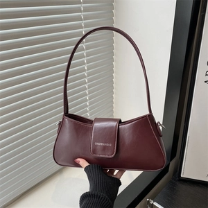 Modern burgundy faux leather baguette bag with top handle and minimalist flap closure