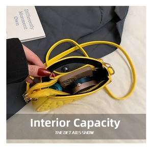 Internal capacity of yellow quilted PU leather bag showing space for phone and makeup