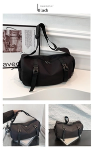 Detail view of large capacity black nylon messenger bag with adjustable strap and buckles