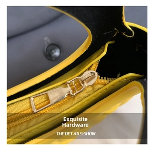 Detail of premium golden metal zipper on a yellow quilted leather semi-circle handbag