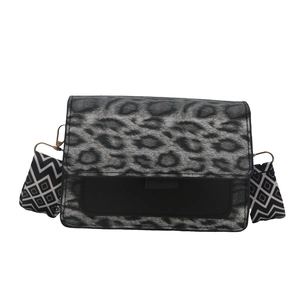 Fashion leopard print shoulder bag with patterned wide strap and black body texture
