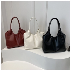 Minimalist faux leather underarm tote bag with gathered pleats in three classic colors
