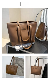 Vue détaillée du grand sac cabas en cuir marron foncé avec élégant logo FASHION gravé