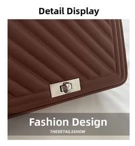 Detail of brown quilted leather bag with silver rectangular twist lock closure