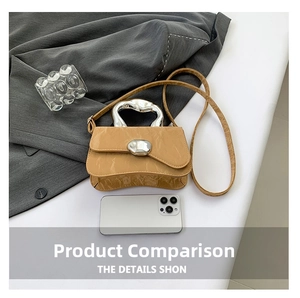 Detail of light brown pleated leather mini bag with silver pebble lock and top handle
