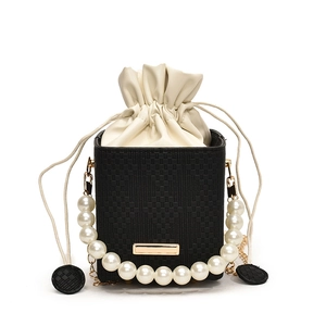 Elegant black woven bucket bag with pearl handle and drawstring closure for women
