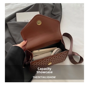 Top view of brown quilted crossbody bag showing interior capacity and magnetic closure