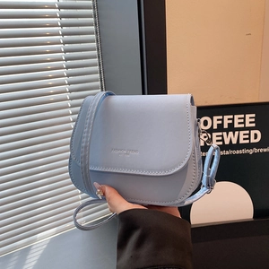Minimalist light blue saddle bag with adjustable strap and fashion trend lettering
