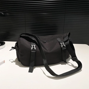 Minimalist black large capacity crossbody messenger bag with adjustable strap and buckles