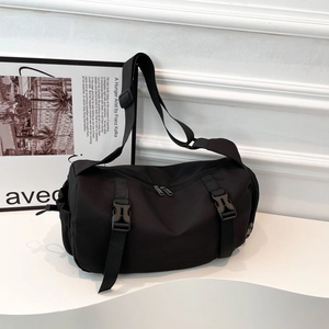 Minimalist black utilitarian crossbody bag with adjustable straps and large capacity