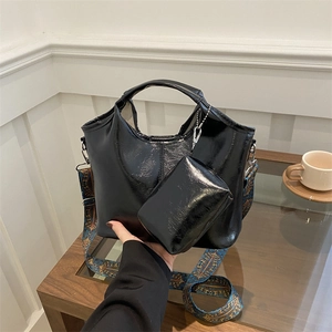 Large black glossy patent leather tote bag set with ethnic style embroidery wide strap