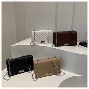 Quilted chain shoulder bags in white brown black and khaki colors with metallic twist lock