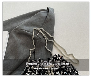Close-up of silver metal chain strap and sparkling sequins on a fashion bucket bag
