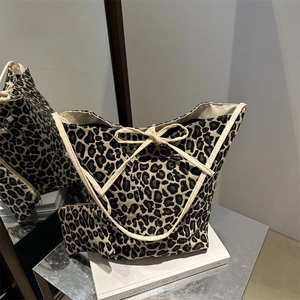 Leopard print tote bag set with oversized knot handles and matching inner pouch