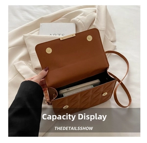 Interior view showing the storage capacity of the brown quilted crossbody square bag