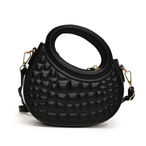 Quilted black semi-circle handbag with round top handle and golden crossbody metal strap