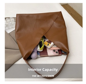 Top view of brown leather tote bag interior showing large capacity for daily essentials