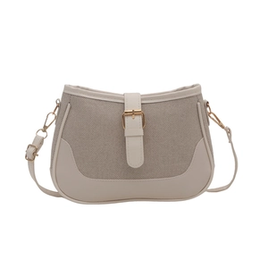 Minimalist beige and brown two-tone crossbody bag with adjustable strap and buckle design