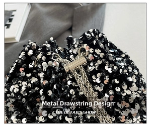 Detail of silver sequin bucket bag featuring a sleek metal drawstring buckle and chain strap