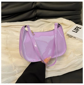 Detail view of glossy lavender patent leather hobo bag with gold zipper and minimalist style