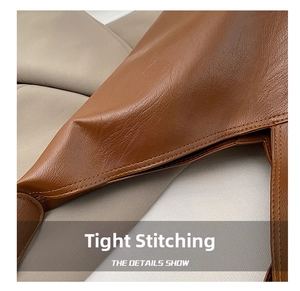 Close-up of precise stitching and premium texture on brown leather shoulder bag