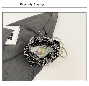 Close-up of sequin bucket bag interior holding perfume and luxury cosmetics
