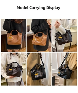 Detail of vintage bucket tote bag in brown and black leather with adjustable straps