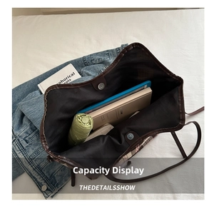Interior view of checkered canvas tote bag showing large capacity for laptop and umbrella