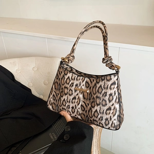 Retro leopard print underarm bag with knotted shoulder strap and gold hardware