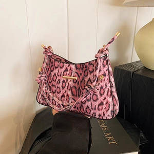Pink leopard print faux fur underarm bag with knot strap and gold metal hardware