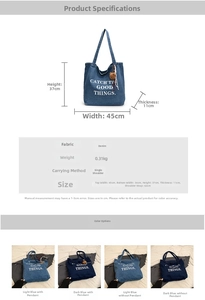 Detail of denim tote bag with letter print and heart bear pendant showing size specs
