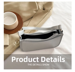 Internal view of silver metallic baguette bag with black lining and smooth zip closure