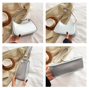 Multi-angle view of a minimalist silver underarm bag with smooth texture and gold buckles