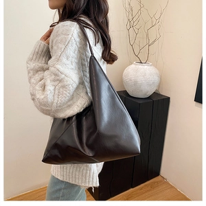 Deep brown large PU leather tote bag with soft triangular structure and glossy finish