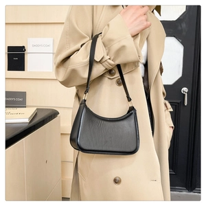 Classic black hobo bag in textured matte leather showing side view and stitching details