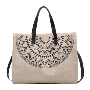 Large canvas tote bag with black mandala ethnic print and leather straps on white background