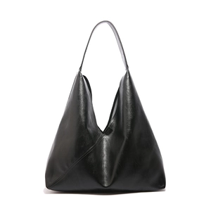 Minimalist large black tote bag with unique geometric origami design and semi-matte finish