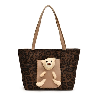 Large leopard print tote bag with plush bear pocket and long faux leather handles