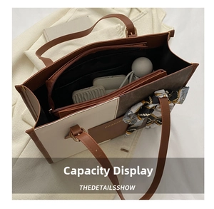 Interior view of large capacity tote bag with smooth zipper pocket and silk scarf