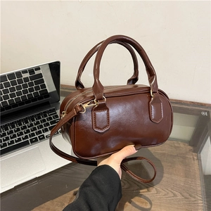 Dark brown oil wax PU leather Boston handbag with round handles and adjustable shoulder strap