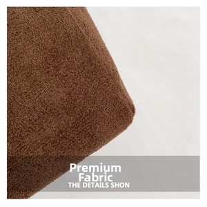 Close-up of brown suede fabric texture showing fine fiber detail on a large tote bag